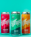 Cans of Hytropics drinks in different flavors on a blue background