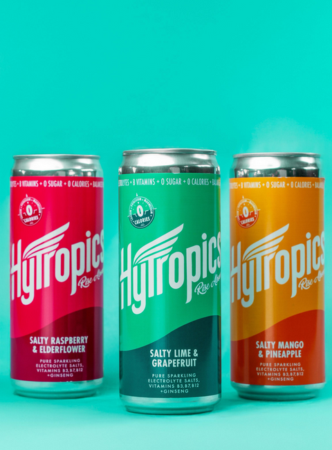 Cans of Hytropics drinks in different flavors on a blue background