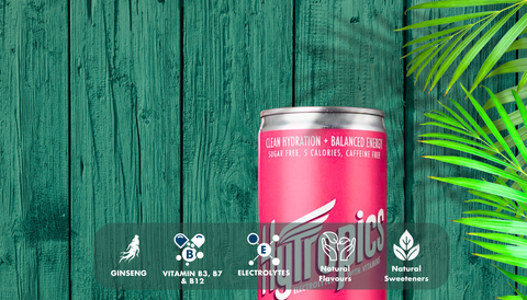 Pink can with branding on a green wooden background